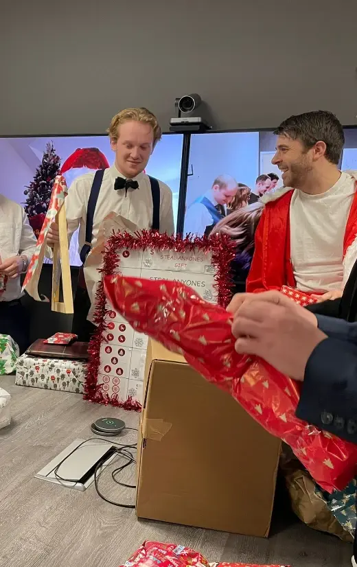 Employees opening Christmas presents