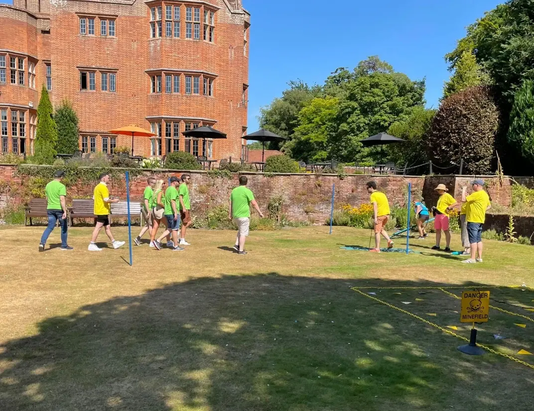 Employees in a garden playing a game