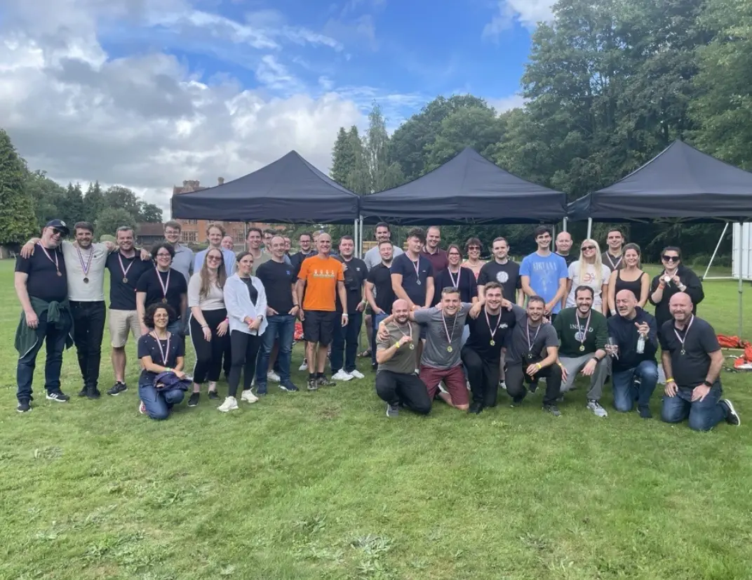 Group photo of employees in a field