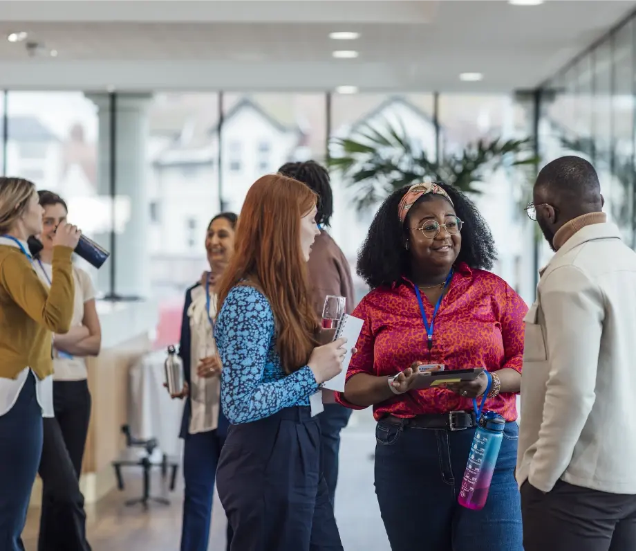 groups of people talking at work