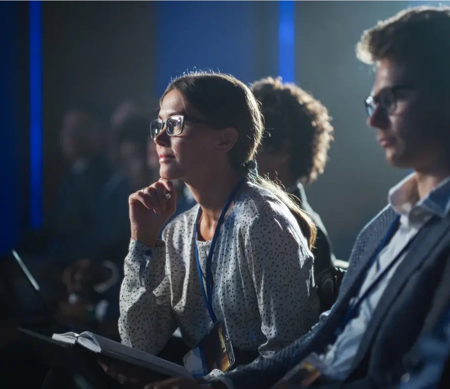 Woman in audience watching intently